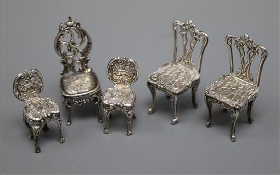 Two pairs of modern silver miniature chairs by Richards & Knight and an early 20th century silver chair.